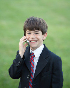 Little Boy Dressed up Talking on Cell Phone